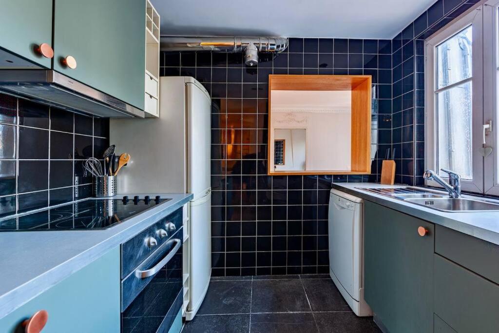 Charmant Appartement Au Coeur De Parijs Buitenkant foto